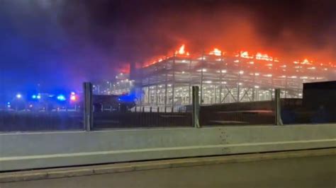 Dozens of flights canceled after fire tears through a parking garage at London’s Luton Airport